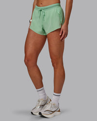 Woman wearing Accelerate 3" Run Shorts - Surreal Green