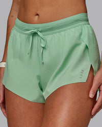 Woman wearing Accelerate 3" Run Shorts - Surreal Green
