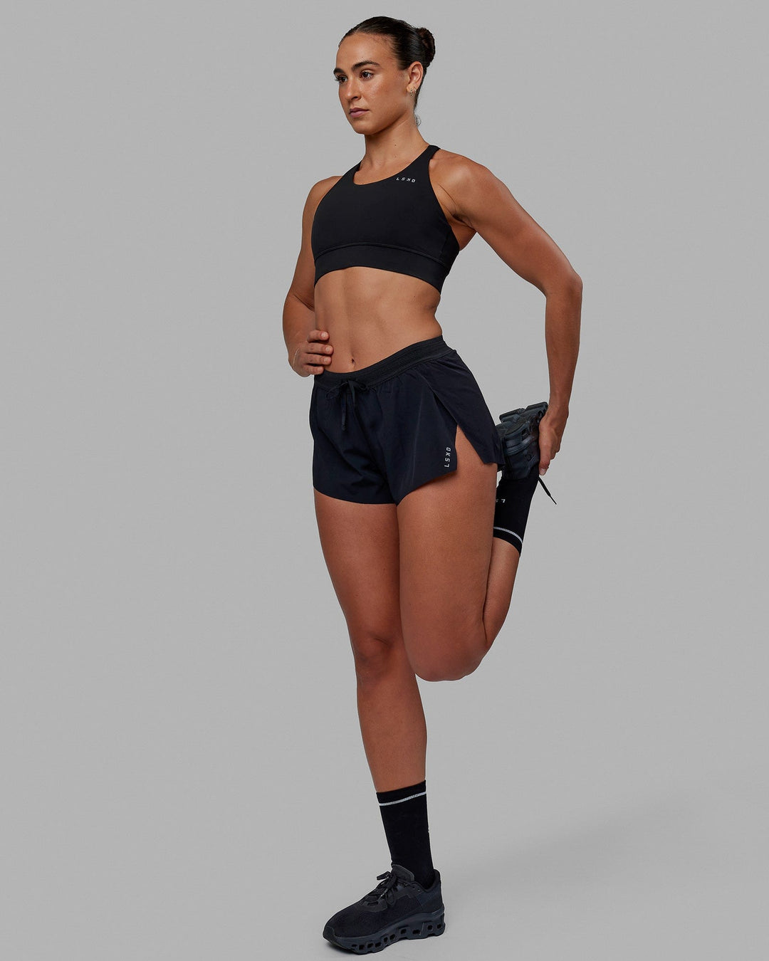 Woman wearing Accelerate Sports Bra - Black
