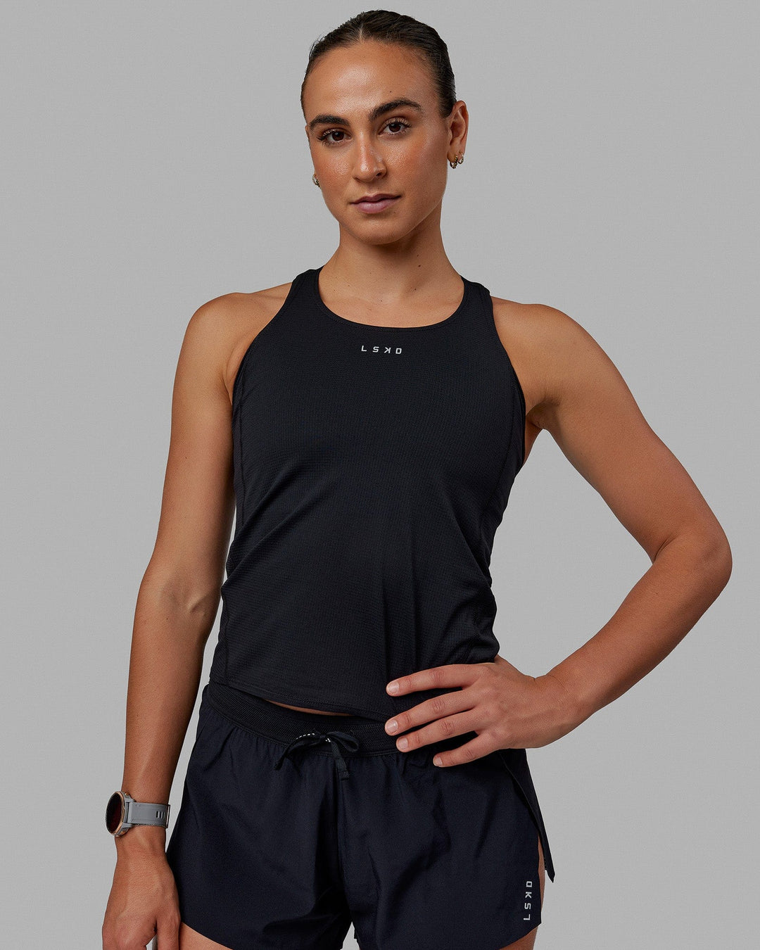 Woman wearing Accelerate Performance Tank - Black