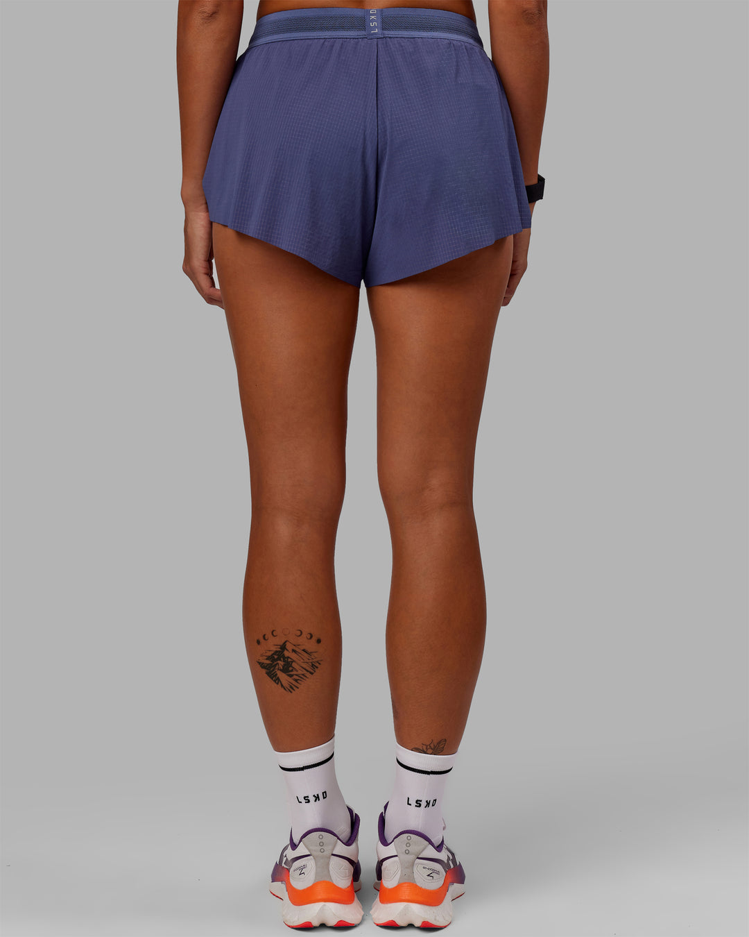 Woman wearing Accelerate Run Shorts - Future Dusk