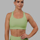 Woman wearing Ace Long Line Bra - Green Fig