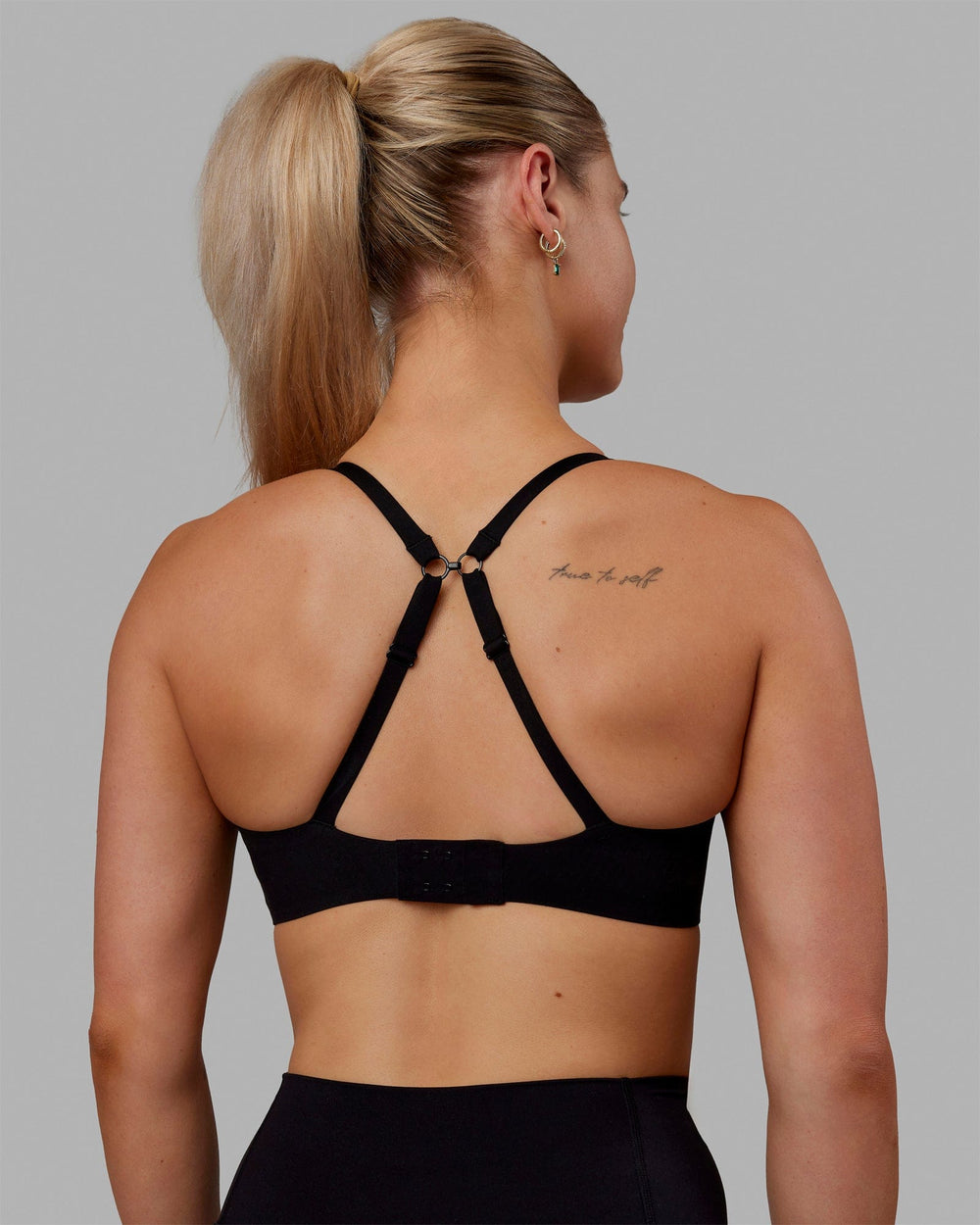 Woman wearing Adapt Sports Bra - Black