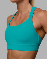 Woman wearing Advance Sports Bra - Uplift Blue