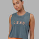 Woman wearing Agile FLXCotton Tank - Storm-Tangerine