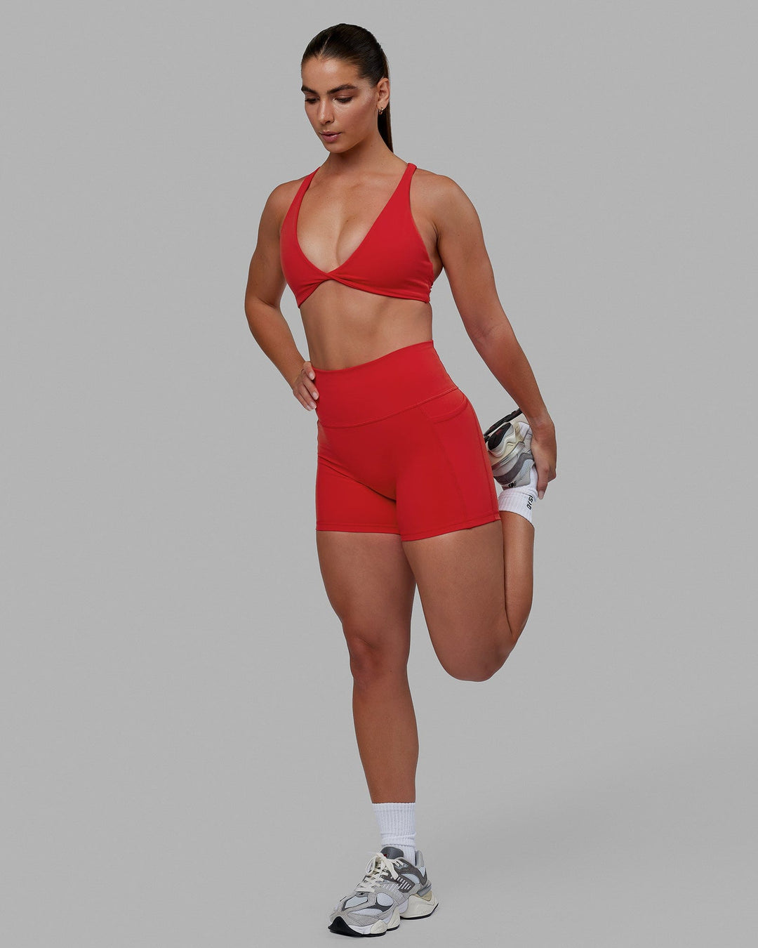 Woman wearing Agile Sports Bra - Infrared
