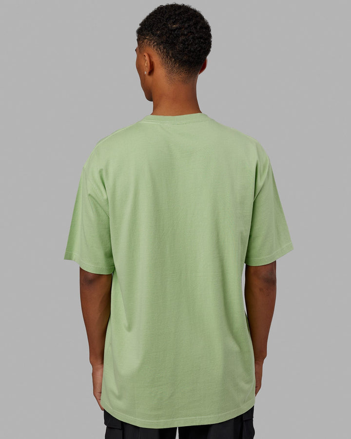 Man wearing Unisex Aligned Heavyweight Tee Oversize - Green Fig