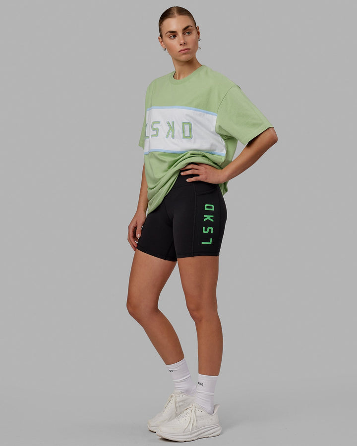 Woman wearing Unisex Aligned Heavyweight Tee Oversize - Green Fig