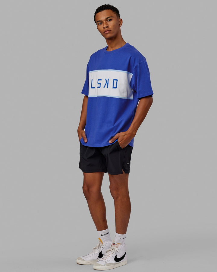 Man wearing Unisex Aligned Heavyweight Tee Oversize - Power Cobalt