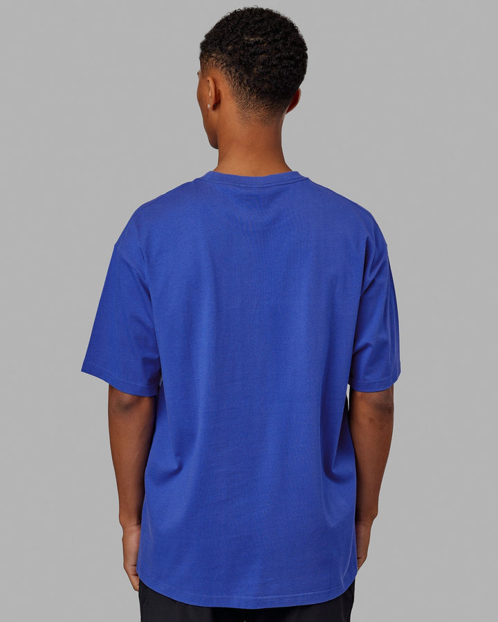Man wearing Unisex Aligned Heavyweight Tee Oversize - Power Cobalt