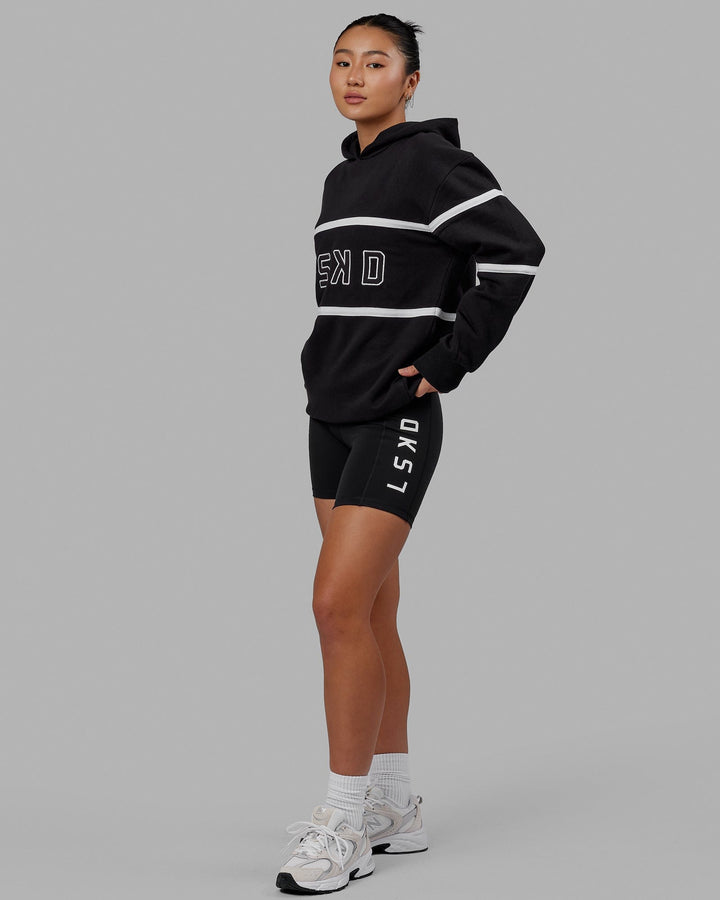 Woman wearing Unisex Aligned Hoodie Oversize - Black
