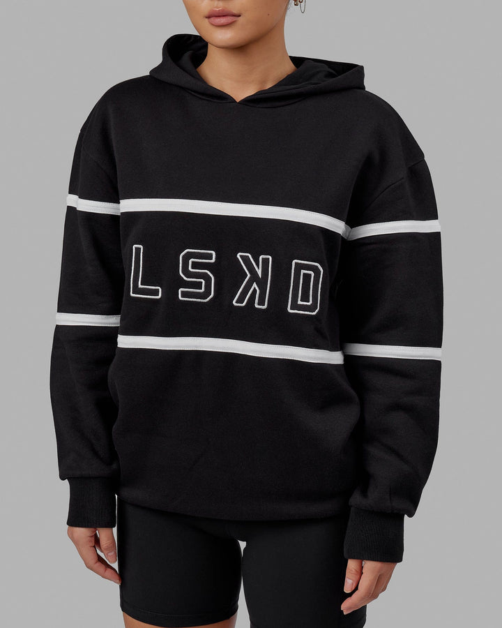 Woman wearing Unisex Aligned Hoodie Oversize - Black