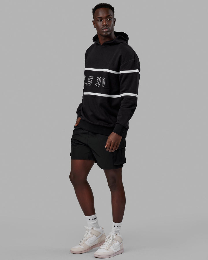 Man wearing Unisex Aligned Hoodie Oversize - Black