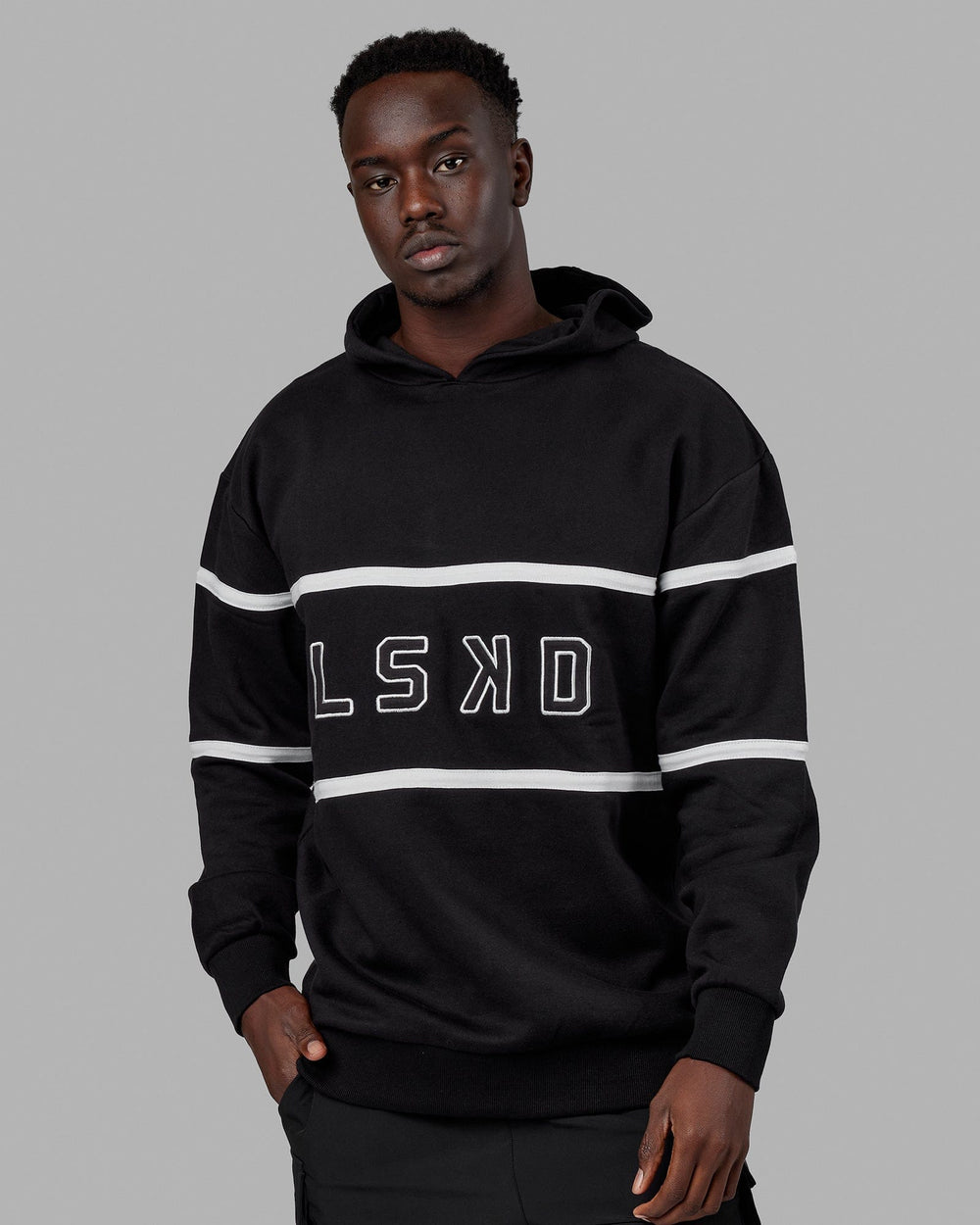 Man wearing Unisex Aligned Hoodie Oversize - Black
