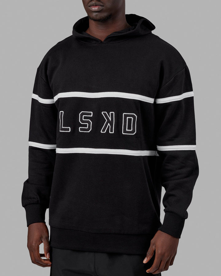 Man wearing Unisex Aligned Hoodie Oversize - Black
