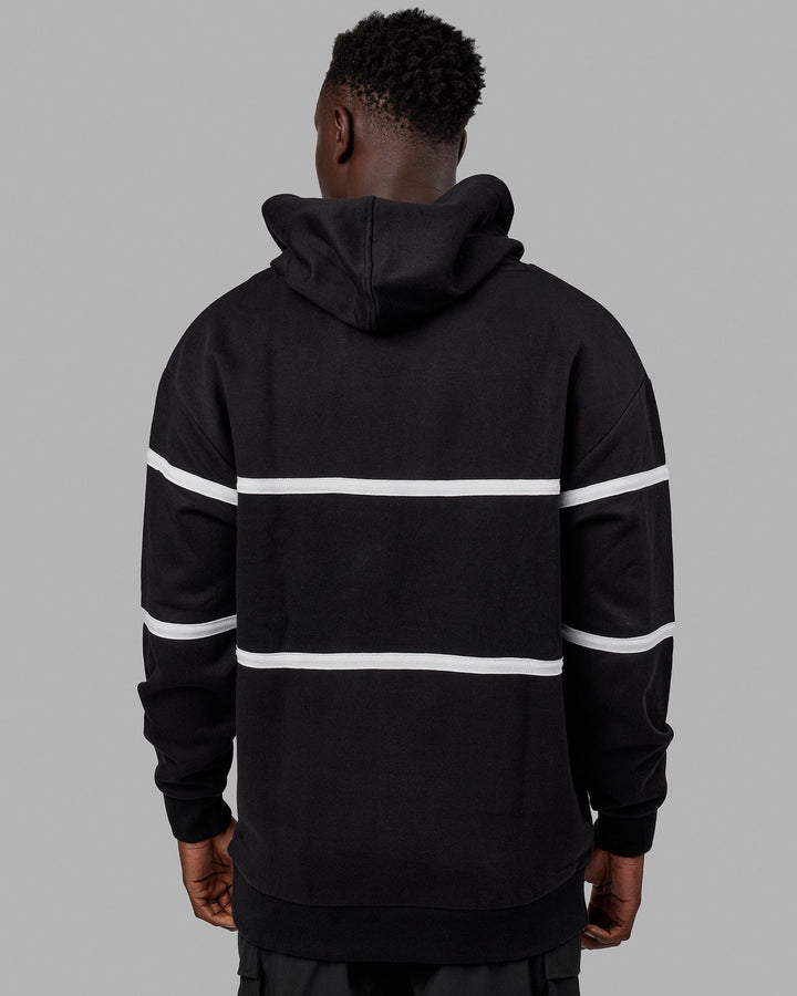 Man wearing Unisex Aligned Hoodie Oversize - Black