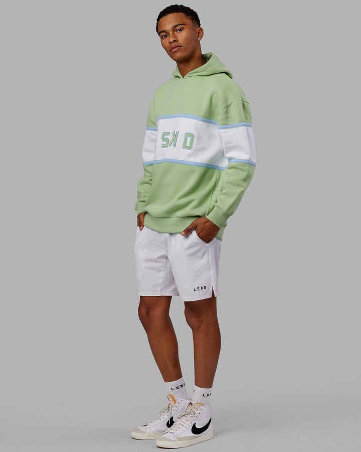 Man wearing Unisex Aligned Hoodie Oversize - Green Fig