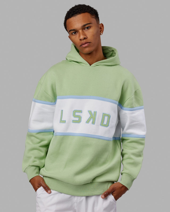 Man wearing Unisex Aligned Hoodie Oversize - Green Fig