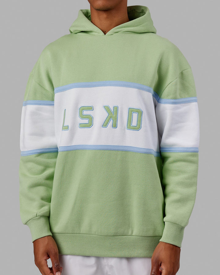 Man wearing Unisex Aligned Hoodie Oversize - Green Fig
