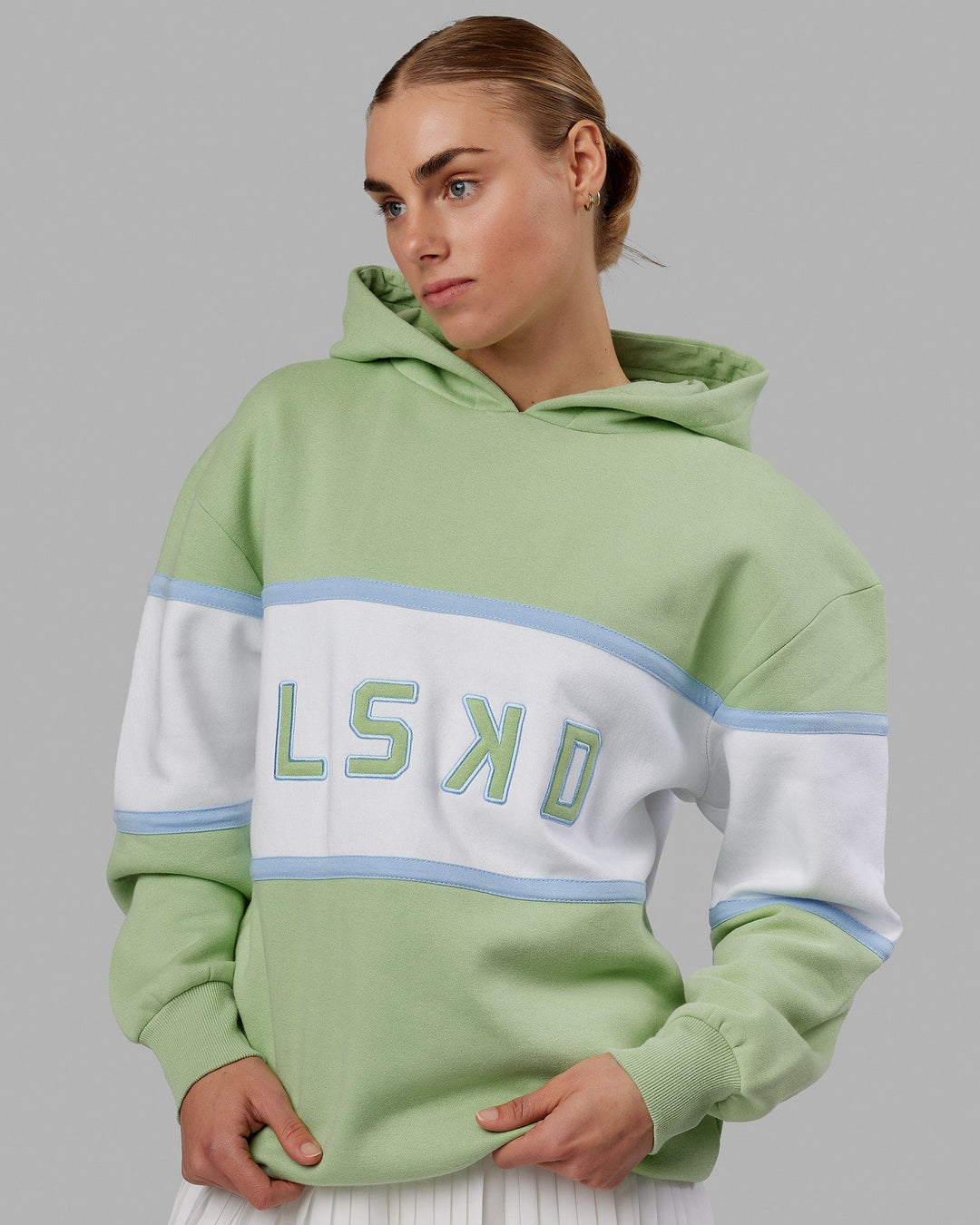 Woman wearing Unisex Aligned Hoodie Oversize - Green Fig