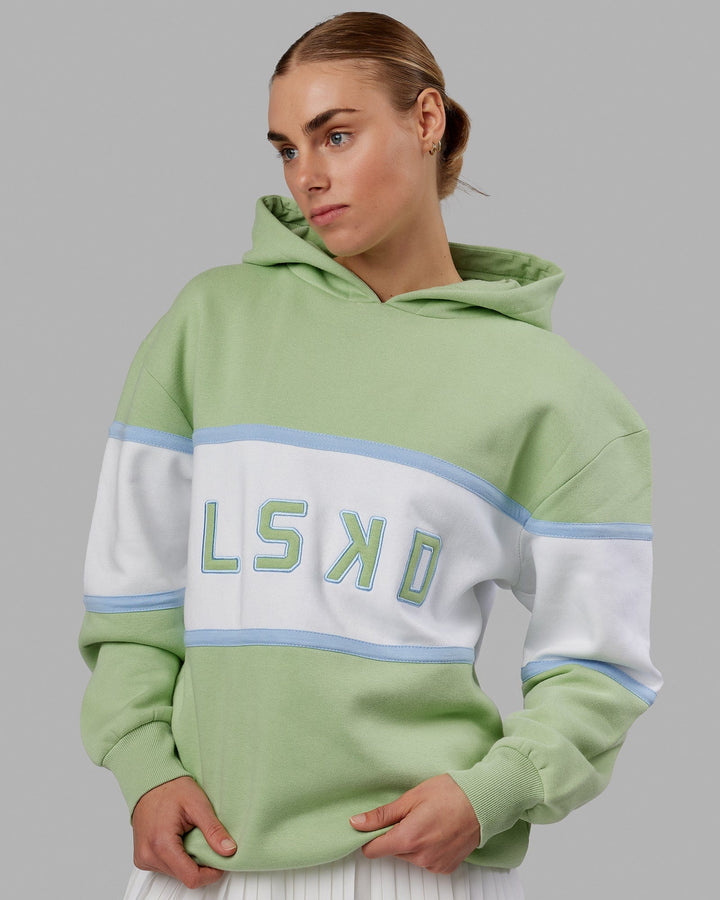 Woman wearing Unisex Aligned Hoodie Oversize - Green Fig