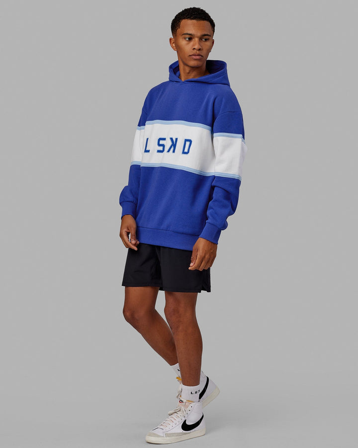 Man wearing Unisex Aligned Hoodie Oversize - Power Cobalt