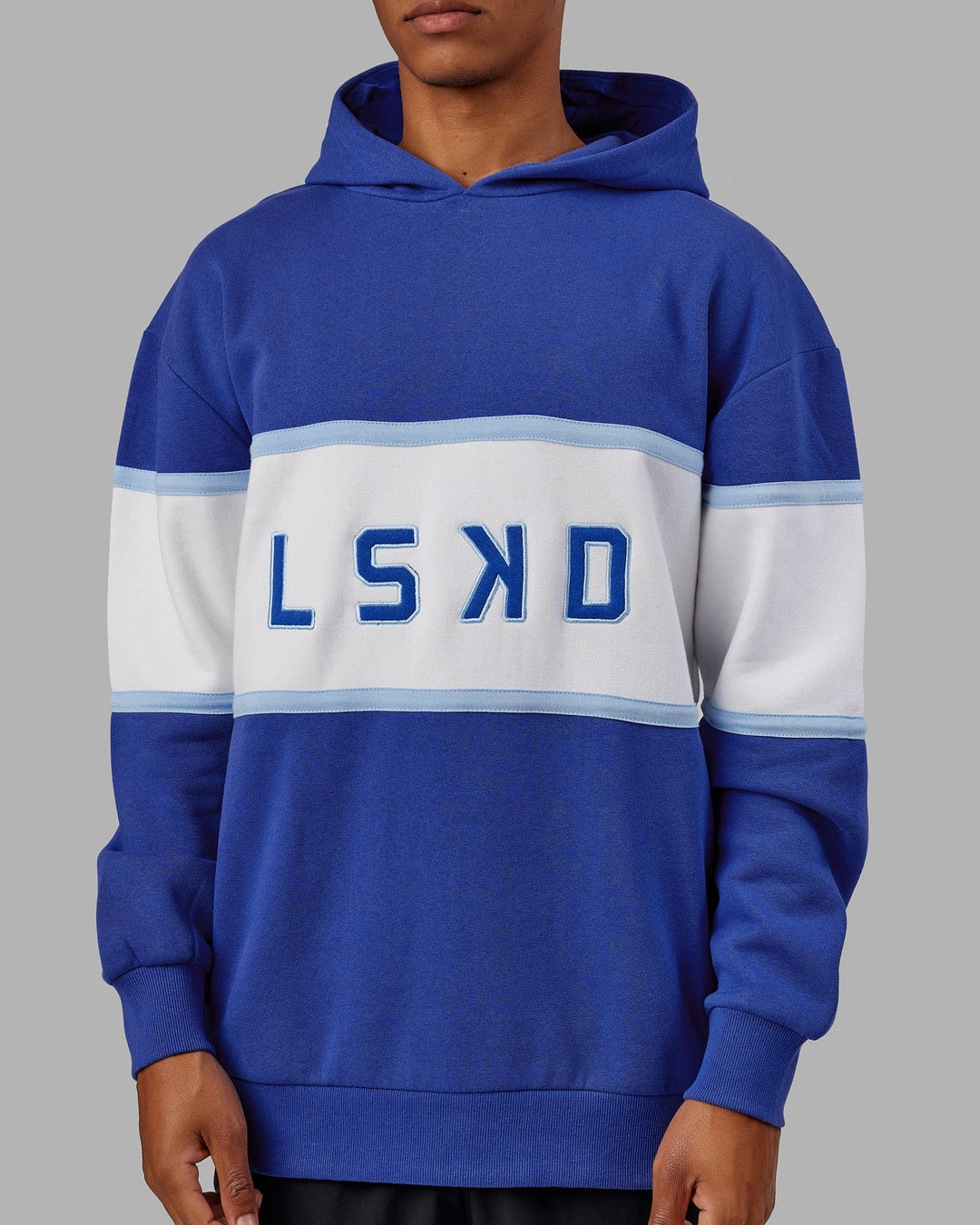 Man wearing Unisex Aligned Hoodie Oversize - Power Cobalt