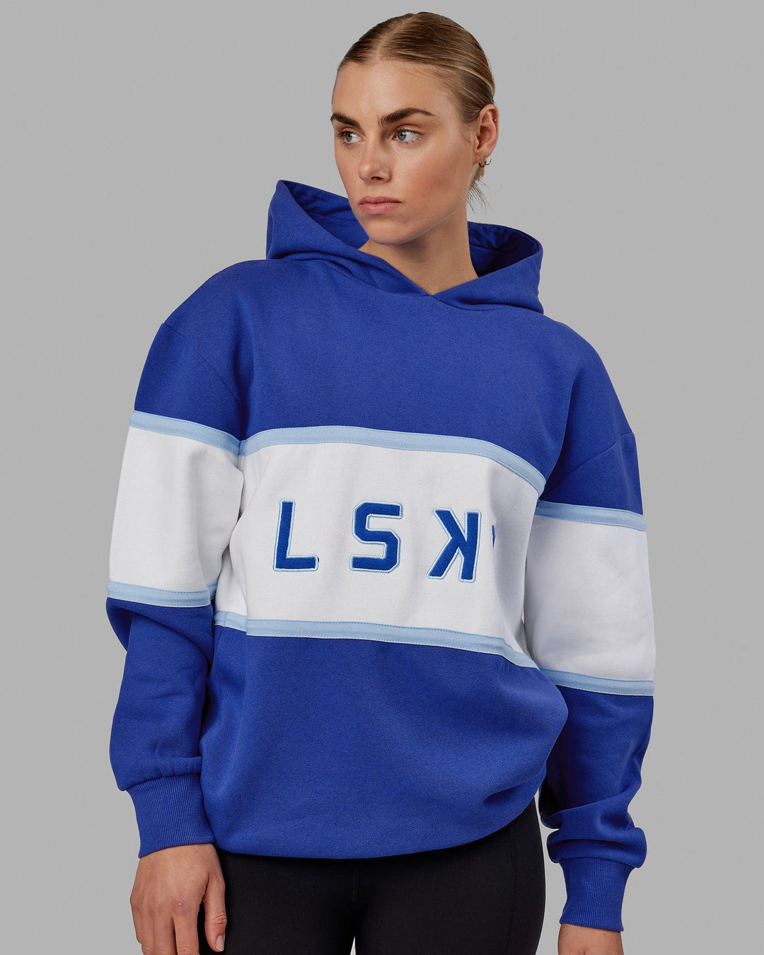 Woman wearing Unisex Aligned Hoodie Oversize - Power Cobalt