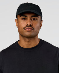 Man wearing All Day Cap in Black