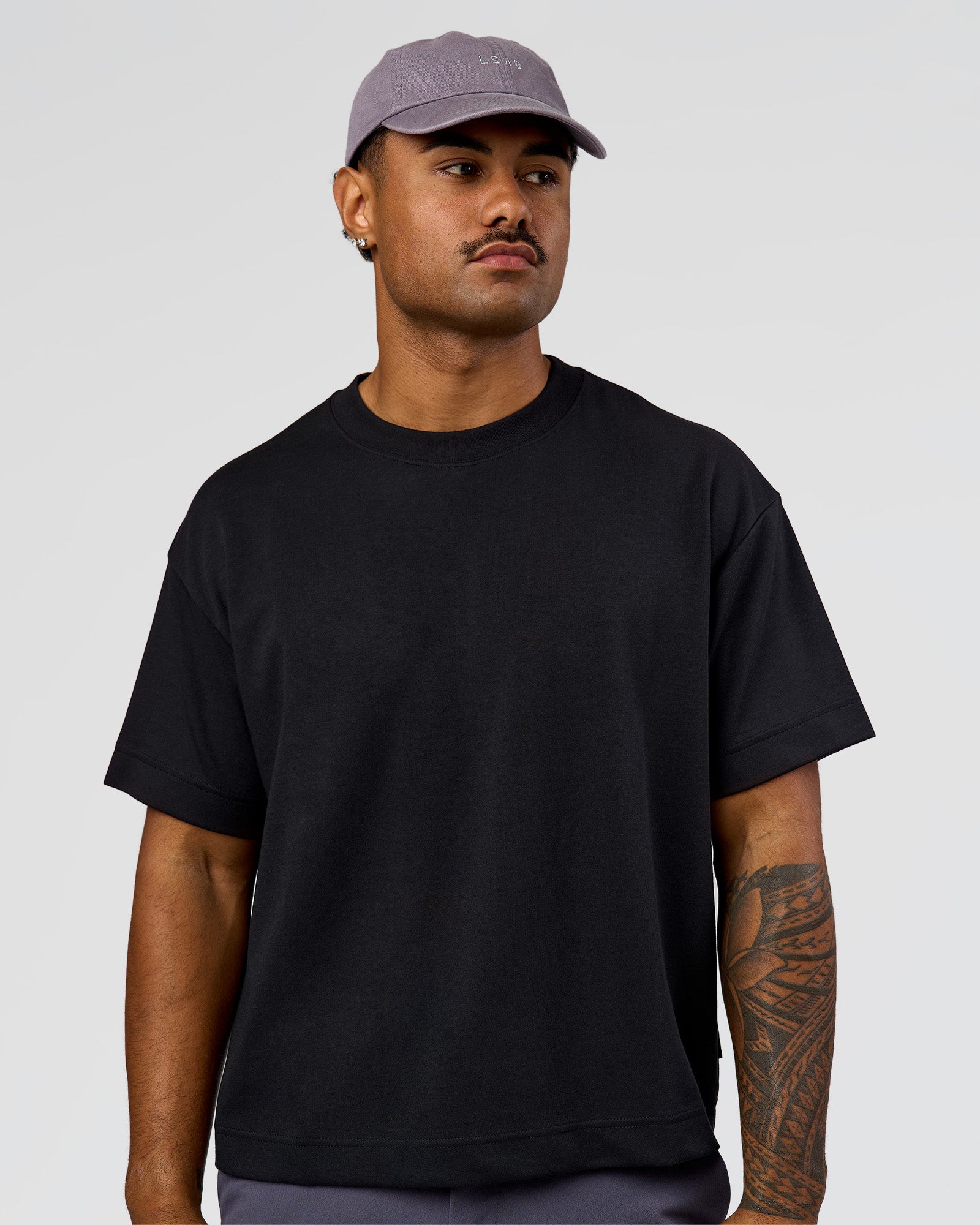 Man wearing All Day Cap in Duskstone