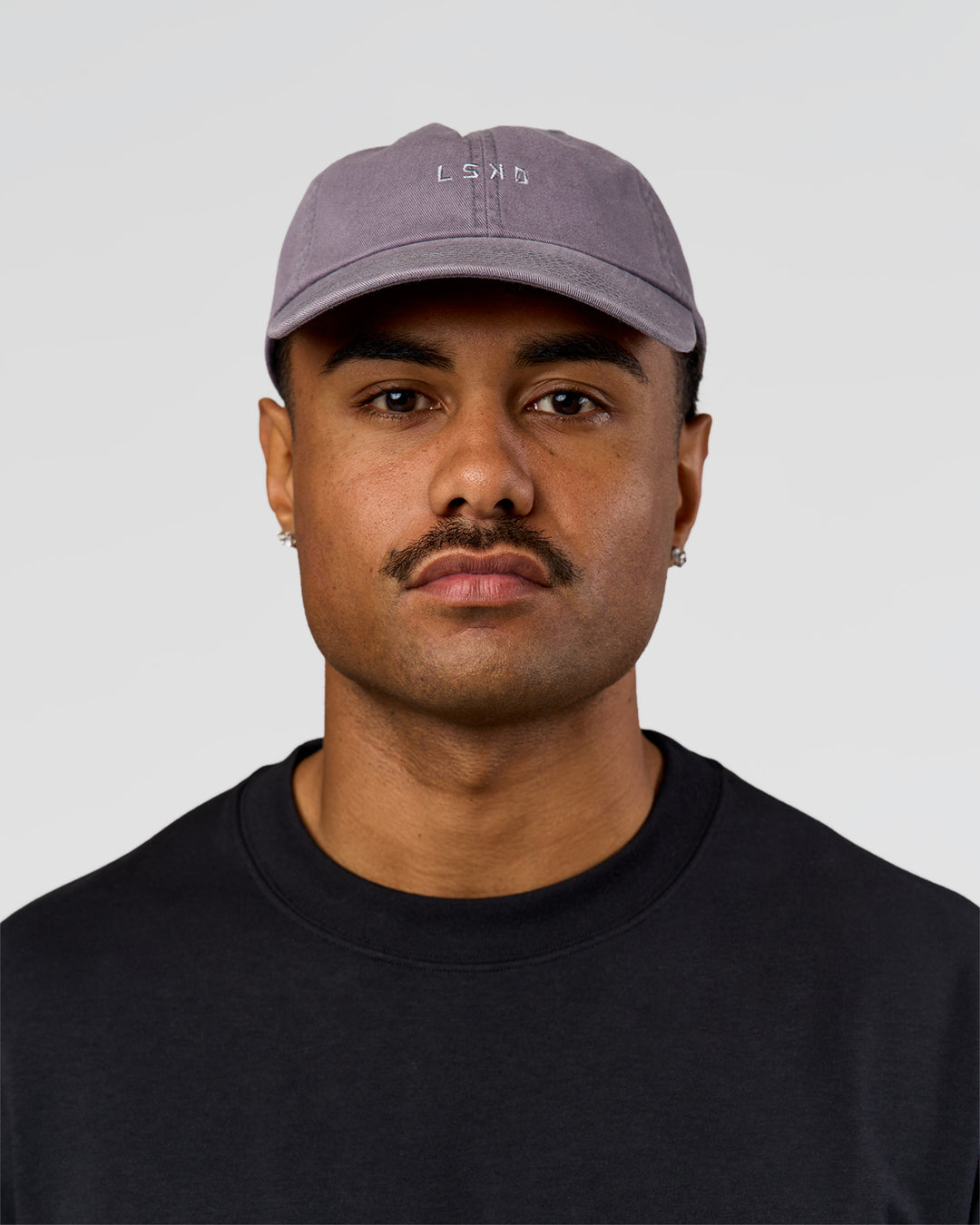 Man wearing All Day Cap in Duskstone