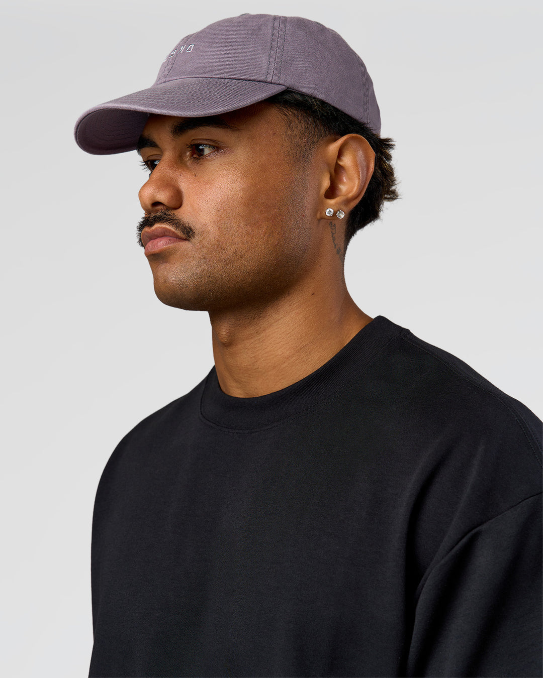 Man wearing All Day Cap in Duskstone