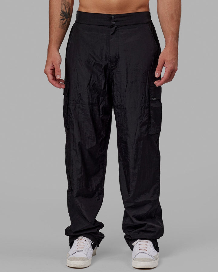 Man wearing Unisex All Day Performance Cargo Pant - Black