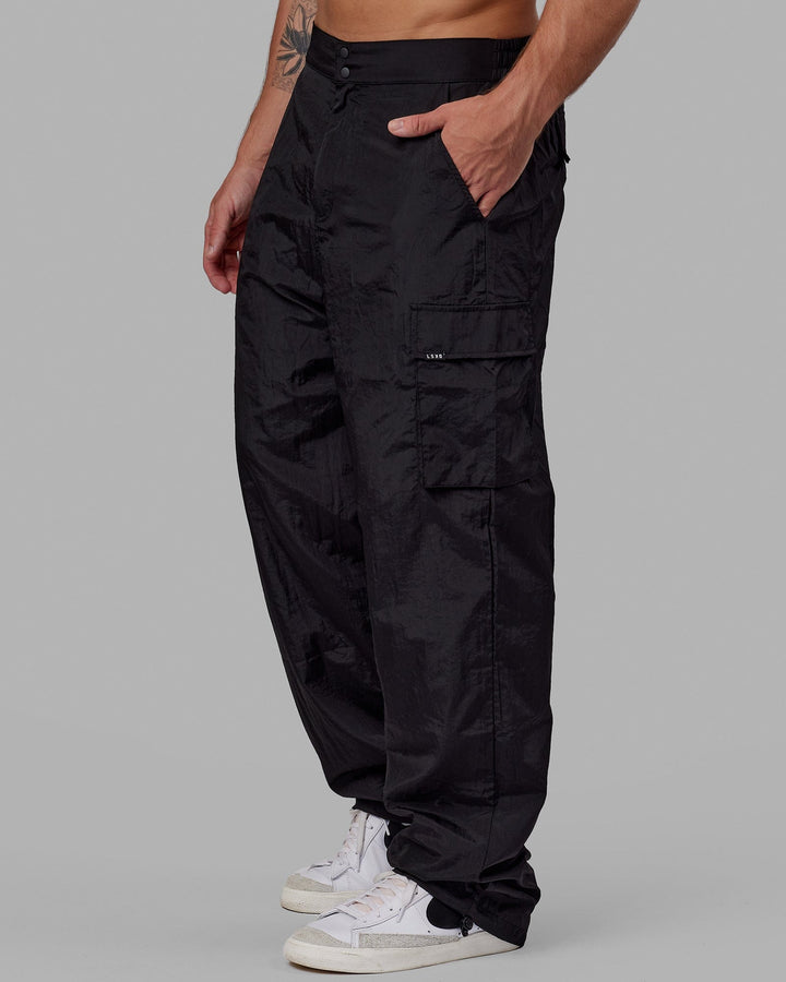 Man wearing Unisex All Day Performance Cargo Pant - Black