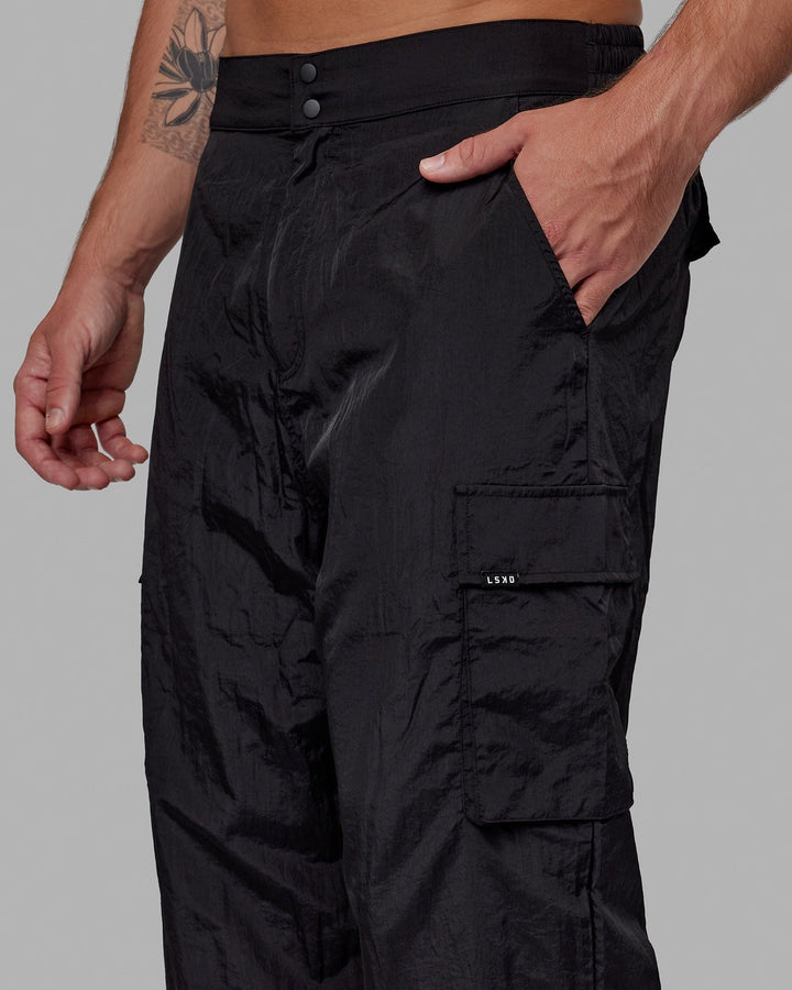 Man wearing Unisex All Day Performance Cargo Pant - Black