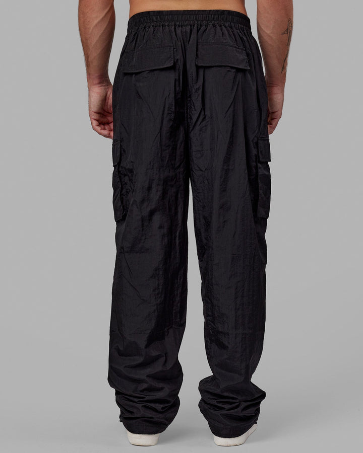 Man wearing Unisex All Day Performance Cargo Pant - Black