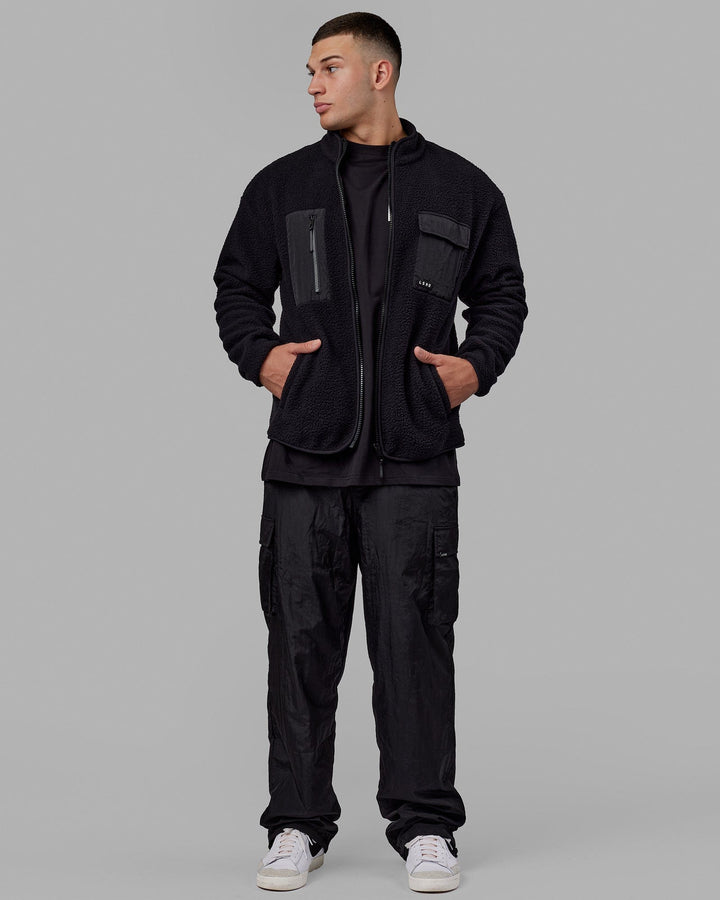 Man wearing Unisex All Day Performance Cargo Pant - Black