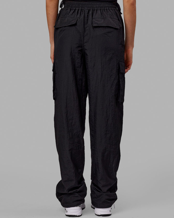 Woman wearing Unisex All Day Performance Cargo Pant - Black