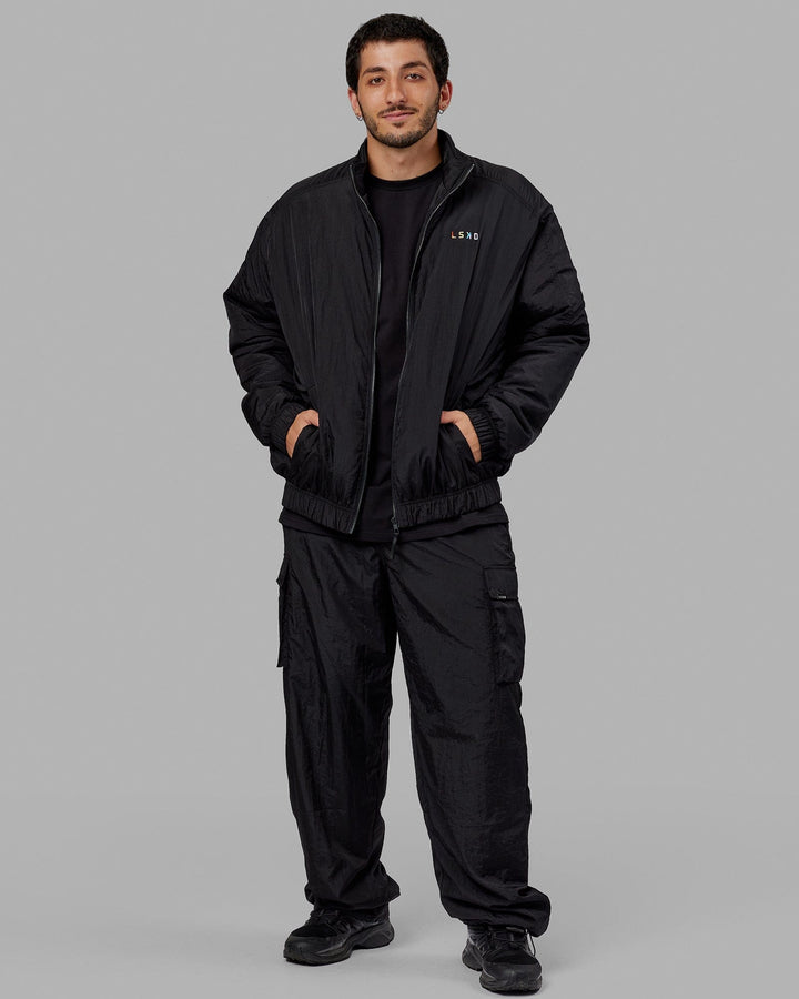 Man wearing Unisex Amplify Bomber Jacket - Black