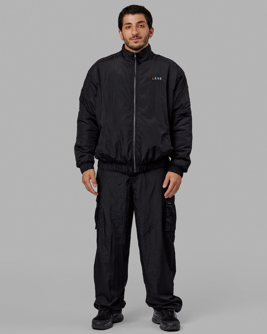 Man wearing Unisex Amplify Bomber Jacket - Black