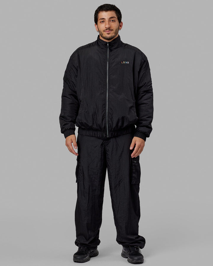 Man wearing Unisex Amplify Bomber Jacket - Black