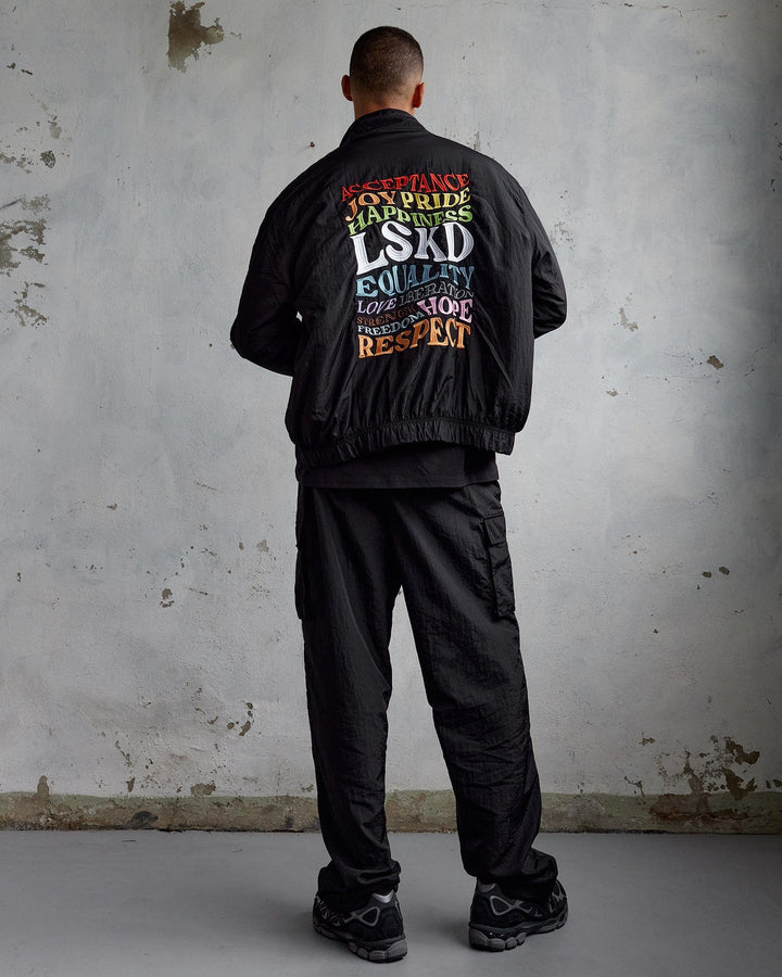 Man wearing Unisex Amplify Bomber Jacket - Black
