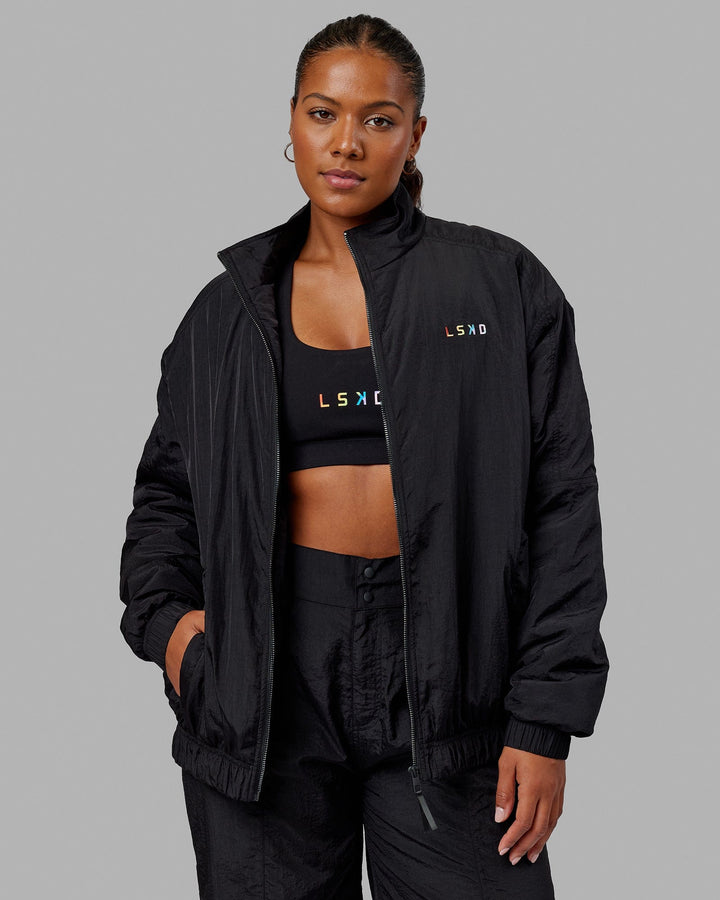 Woman wearing Unisex Amplify Bomber Jacket - Black