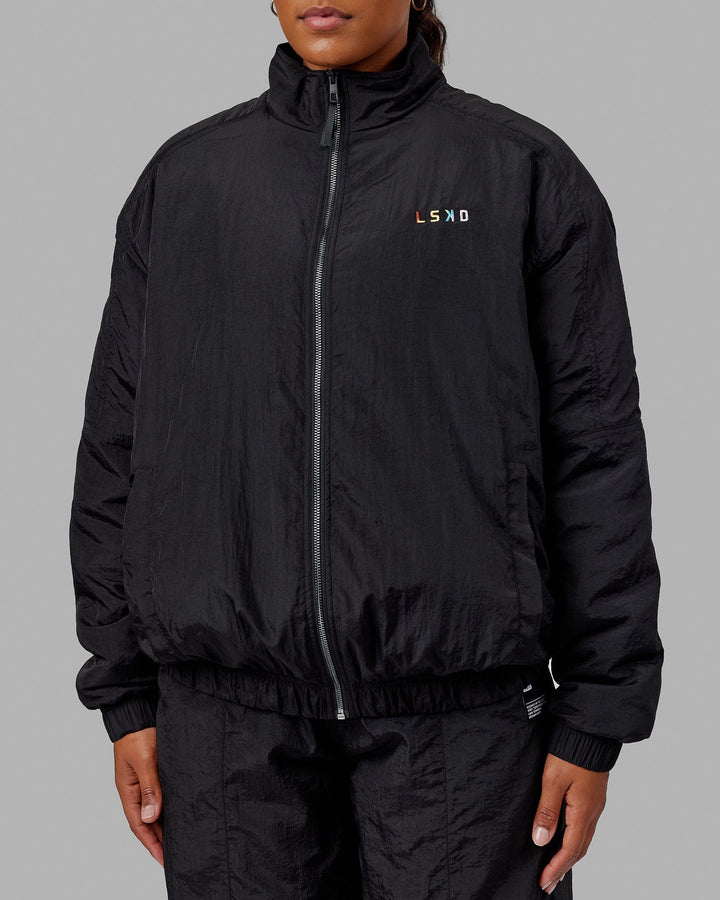 Woman wearing Unisex Amplify Bomber Jacket - Black