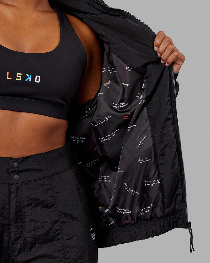 Woman  wearing Unisex Amplify Bomber Jacket - Black