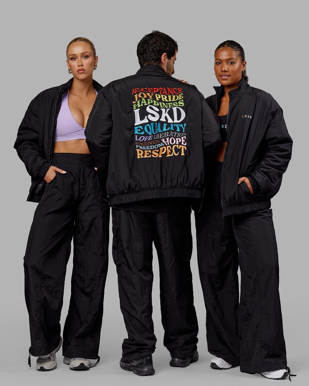 Group wearing Unisex Amplify Bomber Jacket - Black