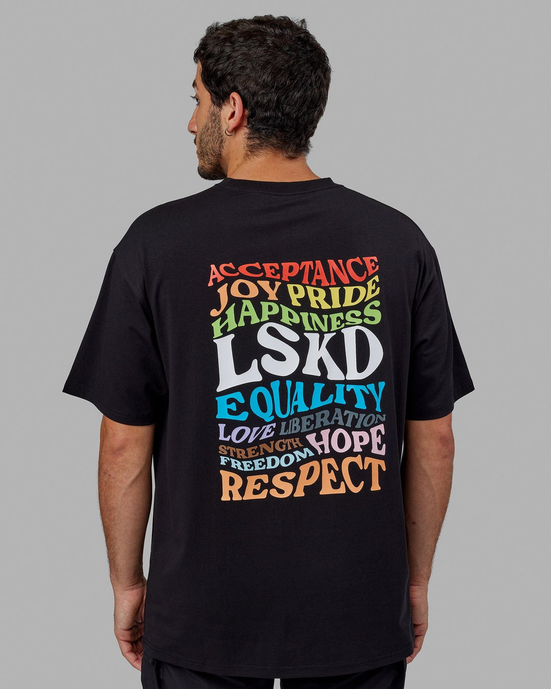 Man wearing Unisex Amplify FLXCotton Tee Oversize - Black