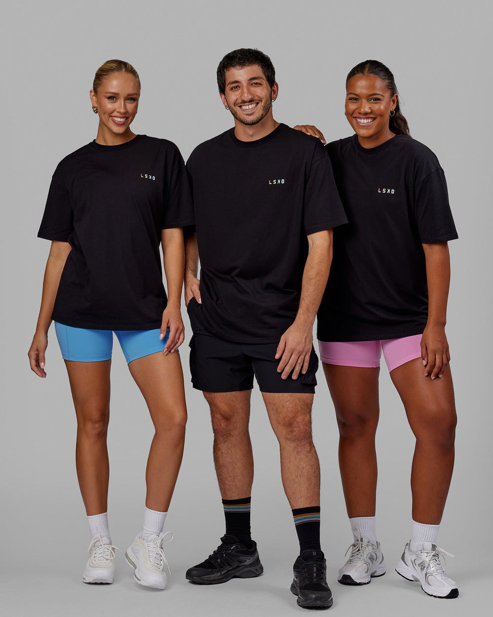 Group wearing Unisex Amplify FLXCotton Tee Oversize - Black