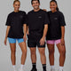 Group wearing Unisex Amplify FLXCotton Tee Oversize - Black