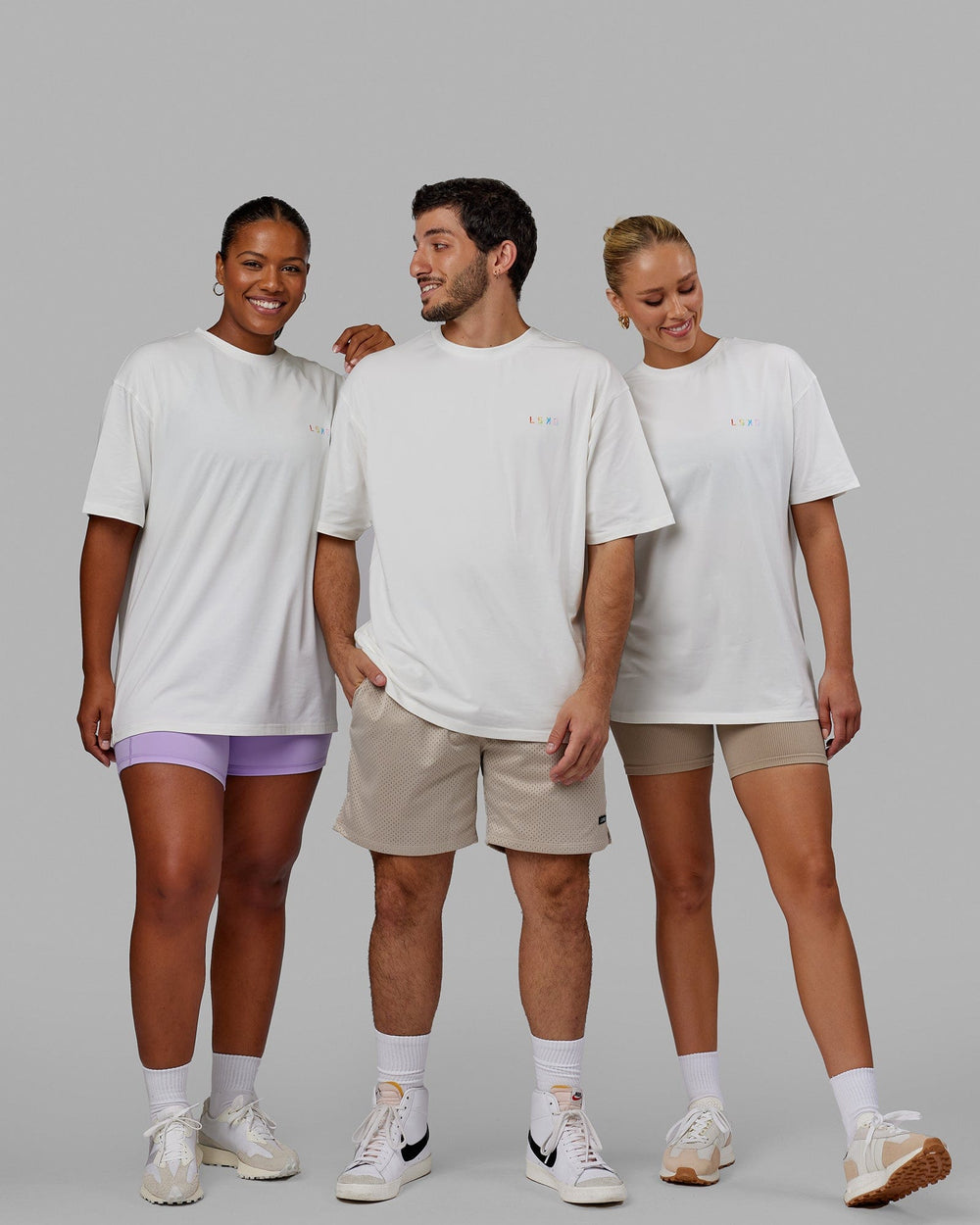 Group wearing Unisex Amplify FLXCotton Tee Oversize - Off White